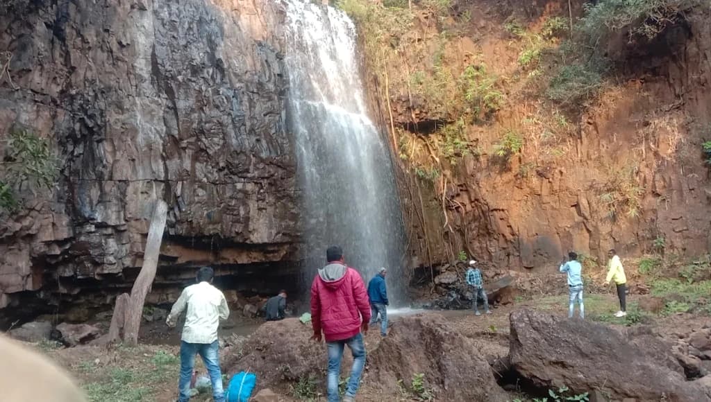 Kanwaldhara Waterfall cascading down a tall rock cliff near Banki in Pandariya, Kabirdham