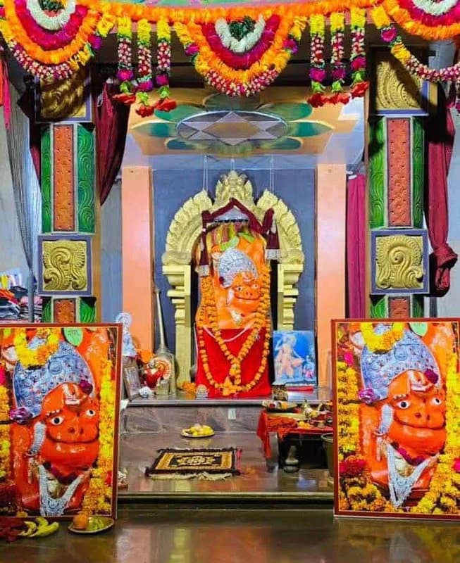 Sanctum courtyard and vermilion deity idol of Khedapati Hanuman Mandir on Nadi Road Kawardha