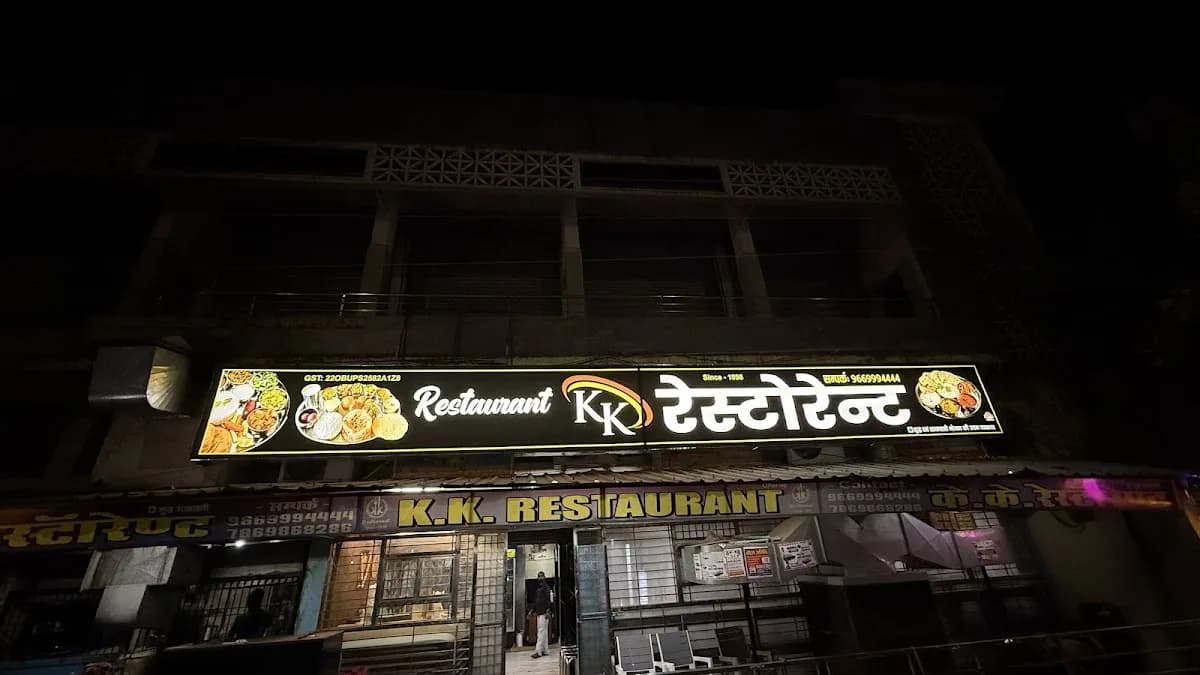 Fresh hot samosas and golden jalebis on counter at KK Restaurant Kawardha