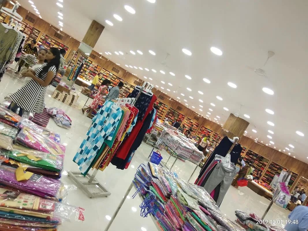 Multi-floor shopping displays and clothing aisles at Sumeet Bazaar Kawardha