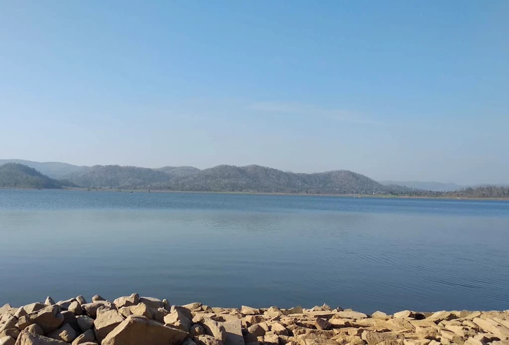 Vast calm waters and surrounding Maikal mountain ridges at Sutiyapat Dam in Sahaspur Lohara, Kabirdham